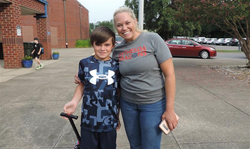 A mother and son smile